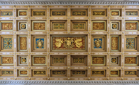 Directly above view of the ornate gilded coffered ceiling inside the Basilica of Saint Paul Outside the Walls in Rome Italy
