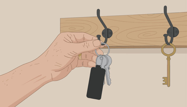 Hand with a ring holding a black leather fob and several metal keys while hanging the bunch on a hook of a wooden wall rack in a home.