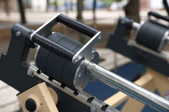 Modern chest press machine in outdoor gym, closeup