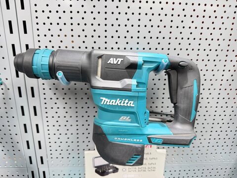 Palma, spain, august 2, 2026, makita brushless hammer drill displaying on a pegboard, offering powerful cordless performance for construction and diy projects