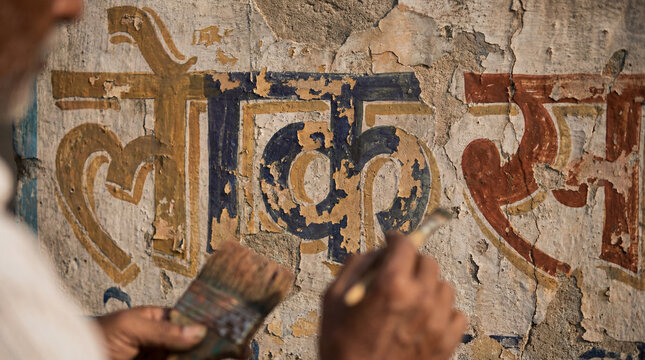Fading Hindi Script Artistry on Cracked Concrete Wall