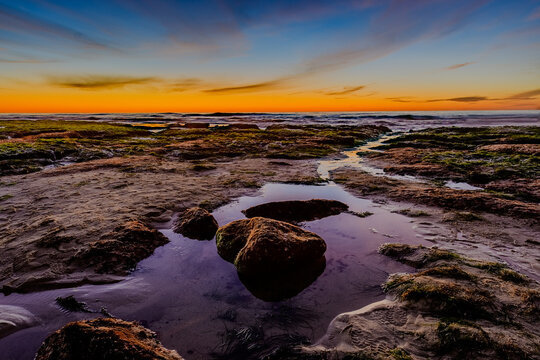 Dramatic Tide Pool Reflection with Rock at Twilight, Colorful HDR Coastal Seascape