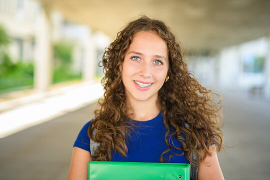 portrait of a teen student in university background