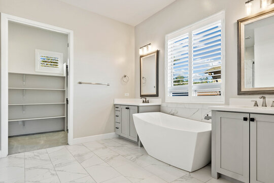 Modern bathroom with freestanding tub and double vanity