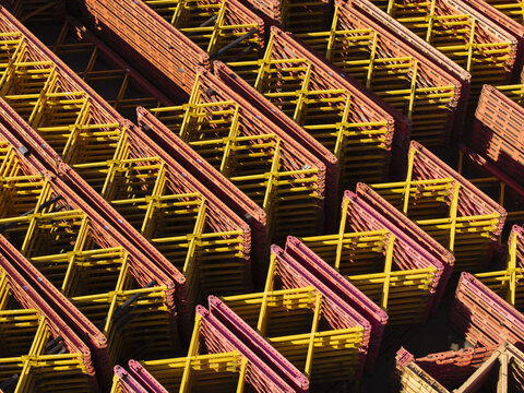Aerial view of stacked yellow and orange construction scaffolding at the PERI Polska Sp. z o.o. facility in Jaworzno, Wojewodztwo slaskie, Poland.