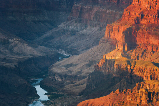 Colorado River Winding Through Grand Canyon with Warm Light on Red Rock Cliffs, Arizona