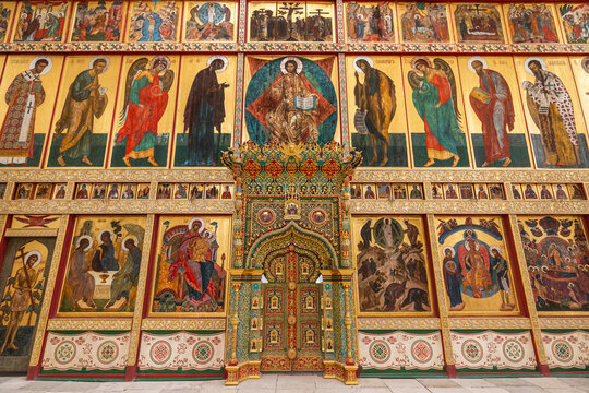 View of the ornate iconostasis at Solovetsky Monastery featuring detailed religious paintings and gold leaf decorations in Solovetsky, Arkhangelsk Oblast, Russia.