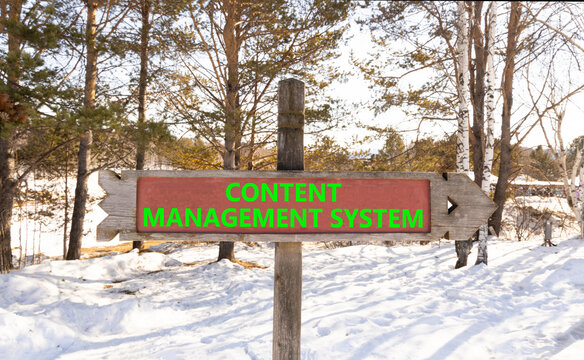 Content management system symbol. Concept words Content management system on beautiful road sign. Beautiful winter forest background. Business content management system concept. Copy space.
