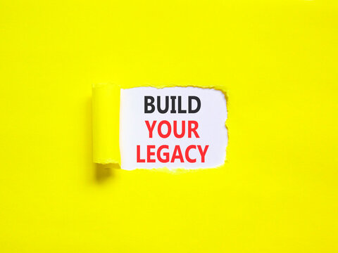 Build your legacy words symbol. Concept words Build your legacy on beautiful white paper. Beautiful yellow background. Business build your legacy concept. Copy space.
