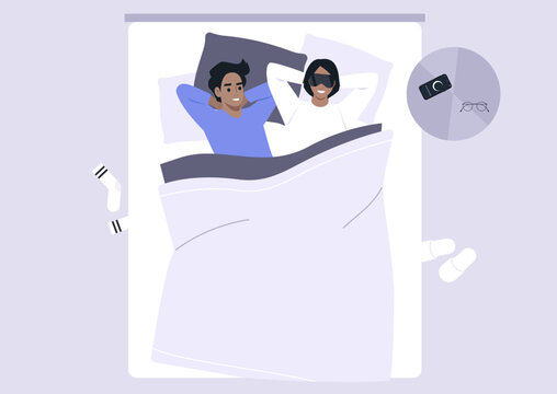 A couple lies comfortably in bed, surrounded by soft blankets, sharing joyful morning moments, Sunlight gently fills the cozy space, creating a warm atmosphere