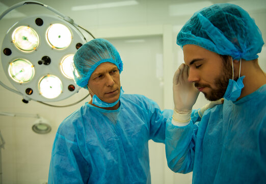 Surgeon Supporting Colleague.