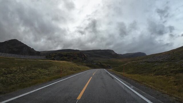 Motorhome driving on a remote road to Nordkapp Norway