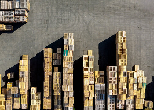 Aerial view of stacks of wooden pallets arranged to resemble a skyline at the Foresco facility in Middenmeer, Noord-Holland, Netherlands.
