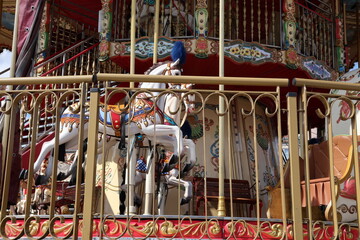 Close-up of colorful carousel horses © Natallia