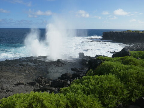 Blowhole spouting large plumes of water on Galapagos Islands