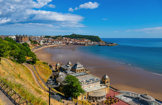 Panoramic view over Scarborough South Bay, beach and historic Spa complex towards the harbour and castle on the Yorkshire coast, England.