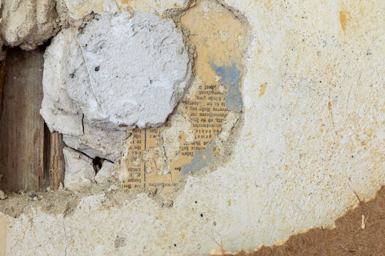 pattern of vintage historic plaster wall after removing the wallpaper in different historic colors as symbol of grunge and time