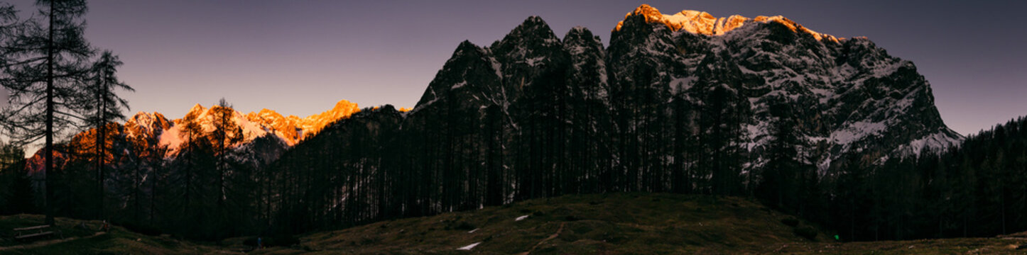 Sunset panorama over Triglav National Park with glowing alpine peaks