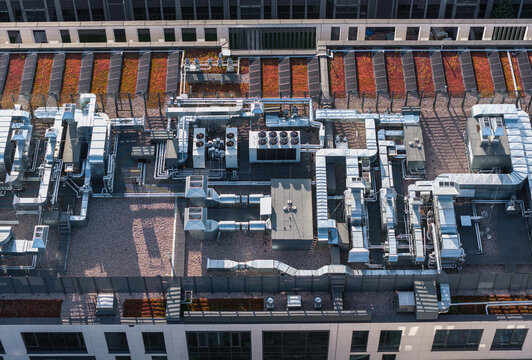 Aerial view of the rooftop of Gdansk University of Technology featuring complex HVAC systems, ventilation ducts, and green roof sections in Gdansk, Pomeranian Voivodeship, Poland.