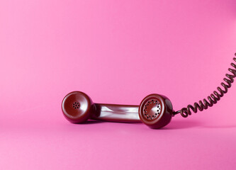 Plakat Vintage Telephone Handset Resting on Bright Pink Background