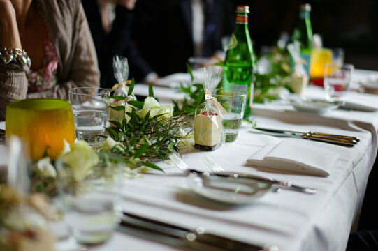 Dinner setup in a restaurant with elegant table arrangements