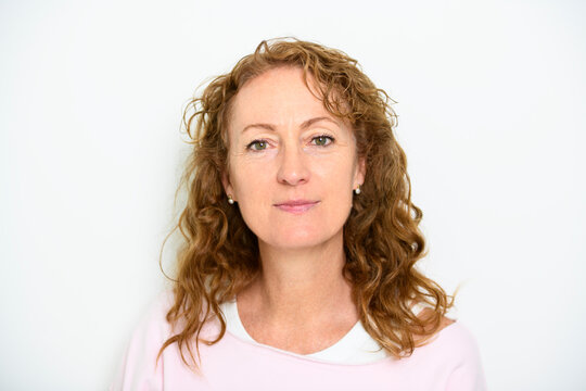 Happy mature woman on studio white background with nice portrait