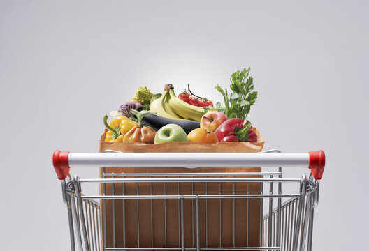 Shopping Cart Filled with Fresh Groceries and Healthy Food