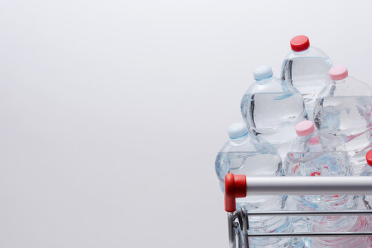 High Angle View of Water Bottles in Shopping Cart with Copy Space