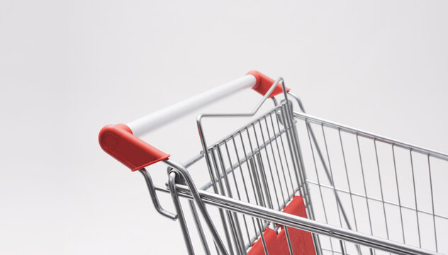 Close Up Angle View of Empty Shopping Cart Handle with Red Accents