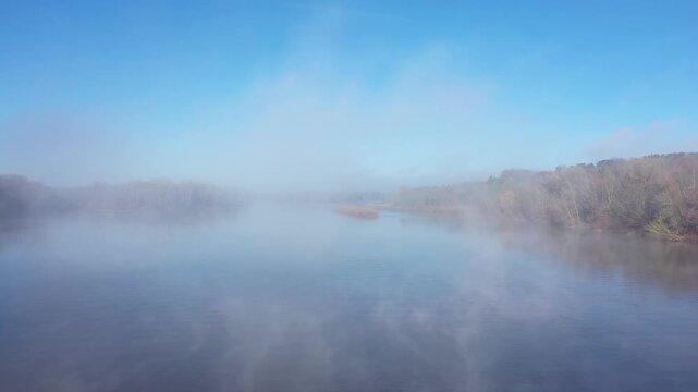 Aerial view of the Loire River bordered by winter trees near La Charite-sur-Loire in central France.