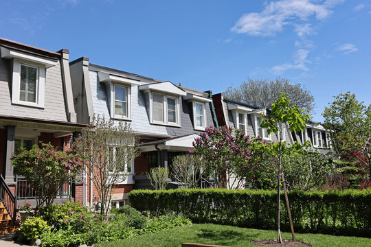 Row of urban semi-detached houses with dormer windows on the second floor
