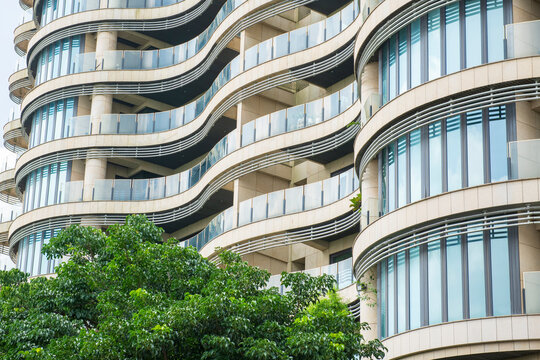Modern Building with Curved Balconies and Greenery