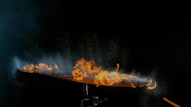 Burning Cymbal With Fiery Explosion on Black Background