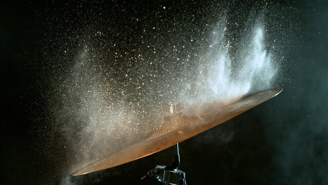 Golden Glitter and White Powder Explosion From Cymbal