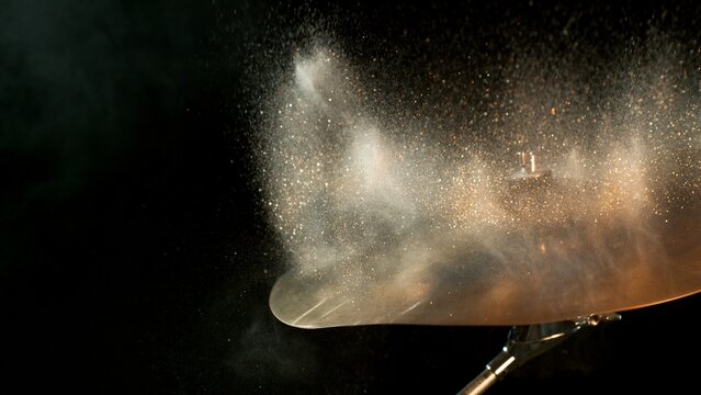 Golden Glitter and White Powder Explosion From Cymbal