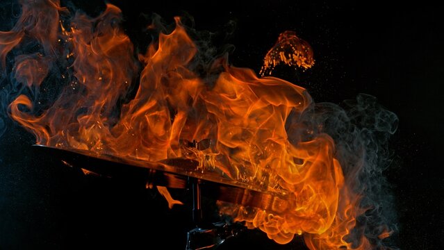 Burning Cymbal With Fiery Explosion on Black Background