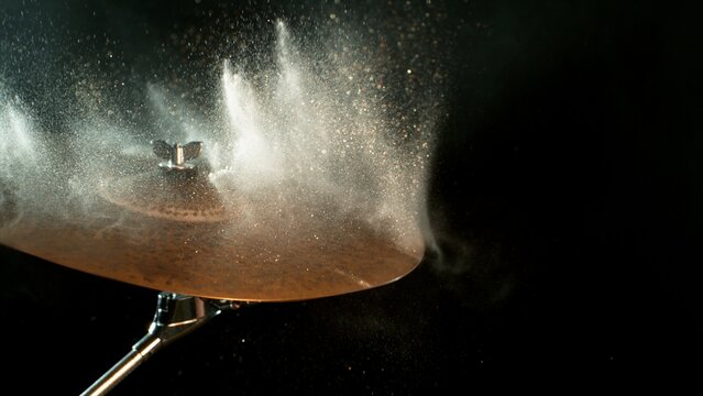 Golden Glitter and White Powder Explosion From Cymbal