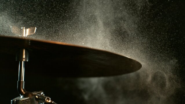 Golden Glitter and White Powder Explosion From Cymbal