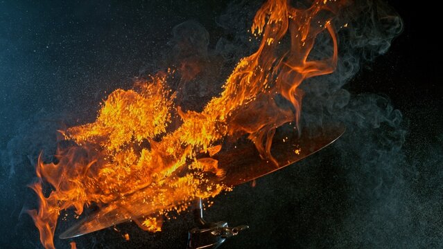 Burning Cymbal With Fiery Explosion on Black Background