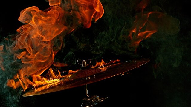 Burning Cymbal With Fiery Explosion on Black Background