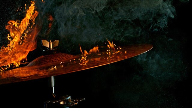 Burning Cymbal With Fiery Explosion on Black Background