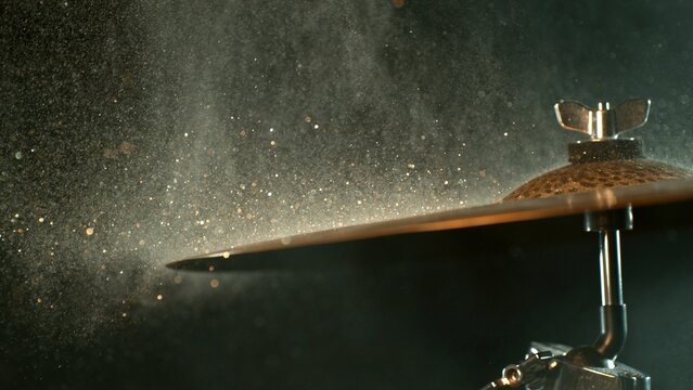 Golden Glitter and White Powder Explosion From Cymbal