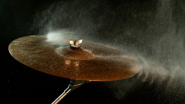 Golden Glitter and White Powder Explosion From Cymbal
