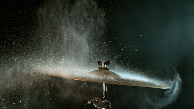 Golden Glitter and White Powder Explosion From Cymbal