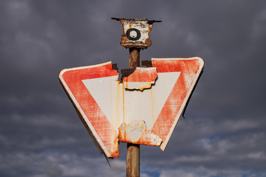 Broken and Rusty Yield Traffic Sign