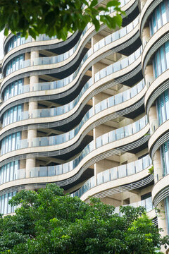 Modern Building with Curved Balconies and Greenery