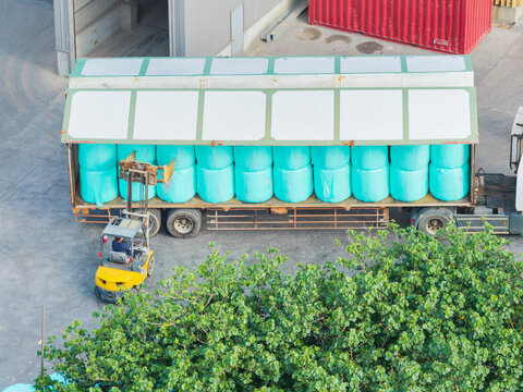 Aerial Forklift Loading Industrial Materials onto Truck