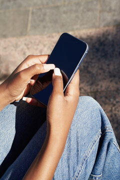 Using a smartphone while sitting outside