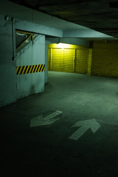 Underground Parking Garage with Direction Arrows