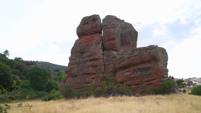 Close up of weathered triassic red stone with honeycomb erosion patterns